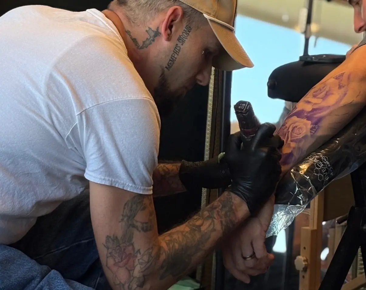 Tyler Shackelford tattooing process with client