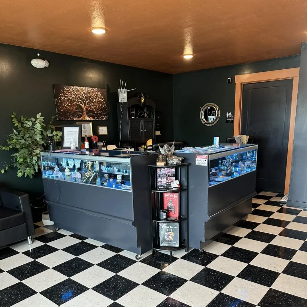 Main shop counter and display case inside The Ink Society studio